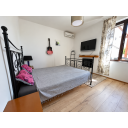 original_1790929456_crisp-minimalist-bedroom-with-guitar-and-window.png