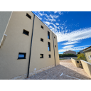 original_1792007221_modern-stucco-courtyard-under-a-cloudy-sky.png