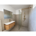 original_1792007309_modern-minimalist-bathroom-with-brass-fixtures.png