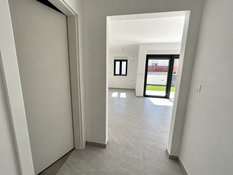 original_1791188457_minimalist-hallway-to-sunlit-living-area.png