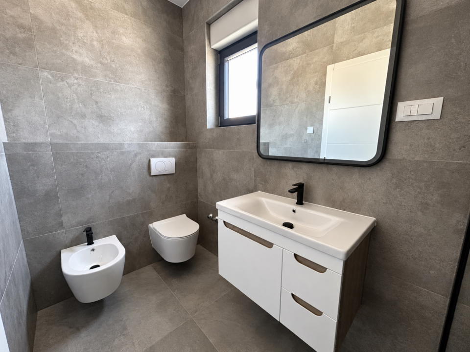 original_1791193069_modern-gray-tiled-bathroom-interior.png