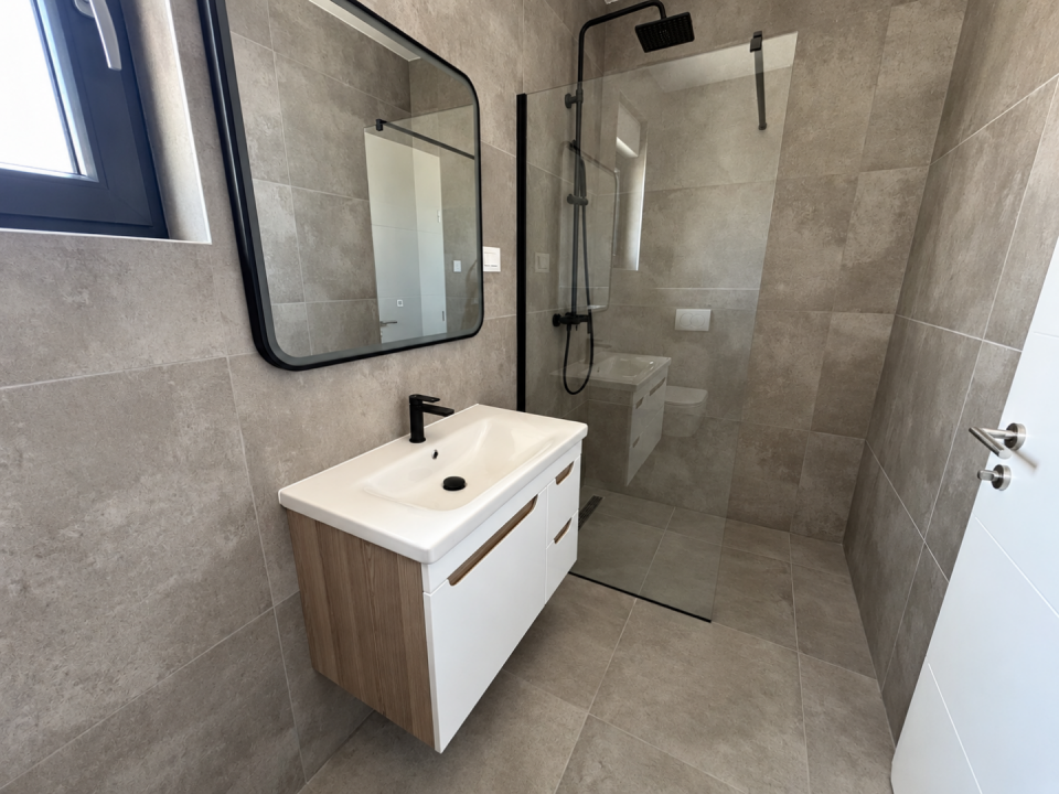 original_1791193082_modern-minimalist-gray-tile-bathroom.png