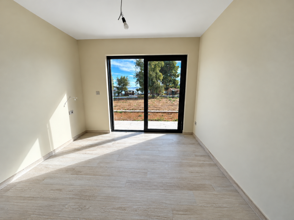 original_1792006887_minimalist-room-with-sunlit-glass-doors.png