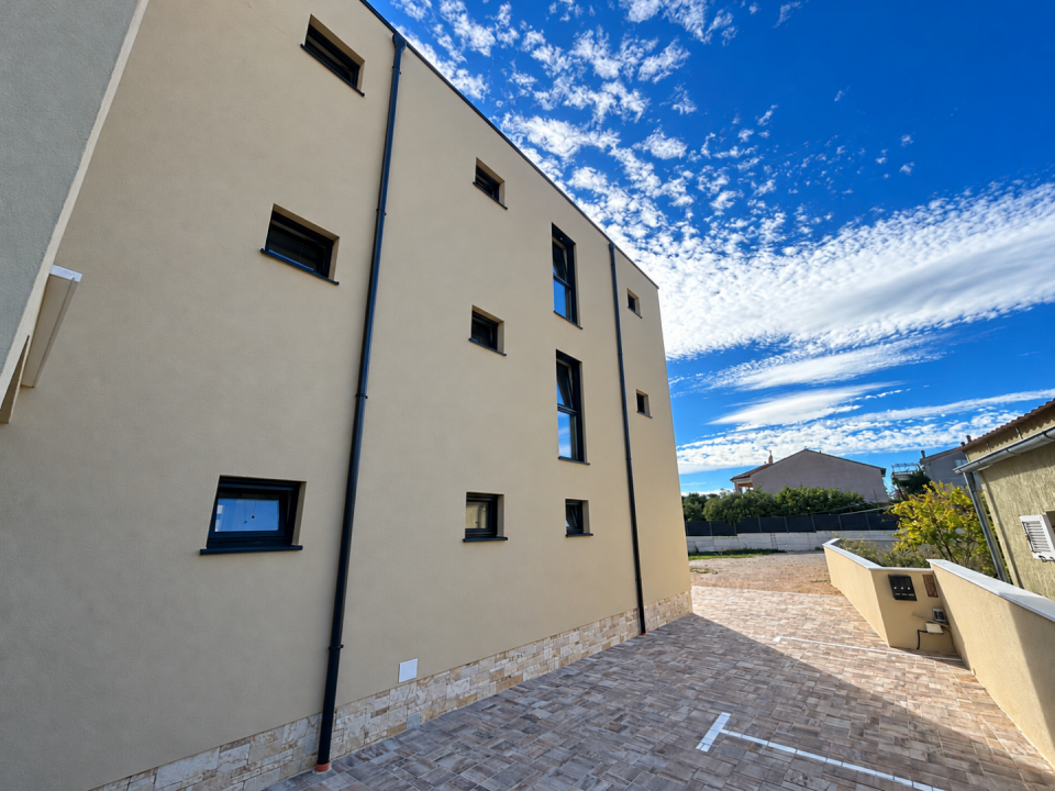 original_1792007221_modern-stucco-courtyard-under-a-cloudy-sky.png