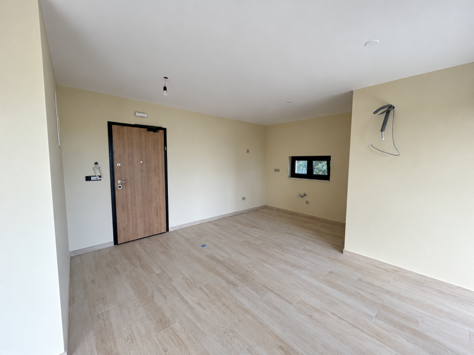 original_1792007266_empty-beige-apartment-interior-with-exposed-wiring.png